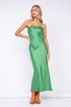 Go to your next formal event wearing the Marla Green Floral Satin Strapless Maxi Dress! Green floral satin fabric shapes this maxi dress with a strapless neckline and an open back. Features a ruched elastic strap in the back - style with your favorite heels and jewelry for a chic formal look! DETAILS & FIT S: 50" Length, " 29 Bust, 28" Waist, 34" Hips M: 51.5" Length, 30" Bust, 30" Waist, 36" Hips L: 52" Length, 31" Bust, 32" Waist, 38" Hips 55% Viscose, 45% Rayon. Machine wash cold. Imported. Strapless Satin Dress With Ruched Bodice For Night Out, Evening Satin Strapless Backless Dress, Formal Satin Strapless Bandeau Dress, Formal Satin Bandeau Strapless Dress, Summer Bandeau Maxi Dress For Prom, Formal Satin Strapless Backless Dress, Bandeau Maxi Dress For Summer Prom, Chic Strapless Satin Dress With Ruched Bodice, Spring Satin Strapless Backless Dress