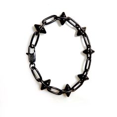 Handcrafted mens bracelet with a heavy pewter antiqued black spikes chain. Super cool and fashion forward, wear it with Jeans and a T-shirt or dressed up. Bracelet measures 7.5" Available in any custom size Made with love in Los Angeles Complimentary gift wrapping provided All sales final. Black Punk Chain Bracelet As A Gift, Black Punk Style Chain Bracelet As Gift, Black Punk Style Chain Bracelet For Gift, Punk Style Black Chain Bracelet Gift, Punk Black Bracelets With Spikes, Black Spiked Edgy Bracelets, Edgy Black Spiked Bracelets, Black Spiked Jewelry As Gift, Black Spiked Jewelry Gift