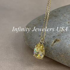 "The pendant pictured is canary yellow simulated diamond #7060 -Approximate total carat weight: approx. 3.60ctw diamond equivalent -Center Stone Size: 12x8mm - approx. 3.60ct diamond equivalent -Center Stone Shape: pear / tear drop -Gem Type: simulated diamond -Stone Clarity: VVS1 -Stone Color: Canary Yellow -Moh's Scale: 8.5 hardness -Metal Type and Purity: 14k yellow gold -Setting: 5 prong basket head -Size: Height with bail approx 15.30mm x Width approx. 8mm -Chain: delicate 14k gold chain / Yellow 14k Gold Jewelry With Diamond Accents, Yellow Diamond-cut Necklace In Fine Jewelry Style, Yellow Diamond Cut Necklace In Fine Jewelry Style, Classic Yellow Diamond Cut Necklace, Oval Yellow Diamond Necklace, Pear-shaped Yellow Jewelry With Diamond Accents, Yellow Pear-shaped Jewelry With Diamond Accents, Yellow Pear-shaped Gemstone Jewelry, Yellow Diamond Teardrop Jewelry