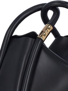 Boyy 'Wonton 25' handbag in black leather with two top handles, gold metal detail, removable shoulder strap, single inner compartment. Composition: 100% Leather Gold Bucket Bag With Top Carry Handle, Gold Bucket Shoulder Bag With Top Carry Handle, Elegant Bucket Bag With Rolled Handles For Daily Use, Gold Shoulder Bucket Bag With Top Carry Handle, Modern Gold Box Bag With Top Carry Handle, Modern Gold Box Bag With Top Handle, Modern Box Bag With Double Handle And Gold-tone Hardware, Modern Box Bag With Gold-tone Hardware And Top Handle, Formal Bucket Bag With Detachable Double Handle