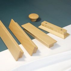 woodworking tools are sitting on a table with white cloth and blue surface in the background