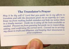 a person holding up a piece of paper that says the translation's prayer