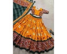 Yellow Chaniya Choli for Navratri Patola Lehenga 3 pc Readymade garba Lehenga Festival outfit Gamthi Work Garba Night lengha ready to wear 🌷Navratri Collection 2024🌷 Adorn yourself in the artistry of Tussar silk and the mesmerizing allure of ikkat Patola prints with this exquisite navratri lehenga choli ensemble Lehenga(Stitched) Lehenga Fabric : Tussar Silk  Lehenga Work : Patola Print With Gamthi Work Lace And Foil Work Lehenga Waist : SUPPORTED UP TO 42 Lehenga Closer : Drawstring With Heav Yellow Chaniya Choli, South Indian Lehenga, Patola Lehenga, Garba Lehenga, Chaniya Choli For Navratri, Choli For Navratri, Gamthi Work, Lehenga Stitched, Garba Night