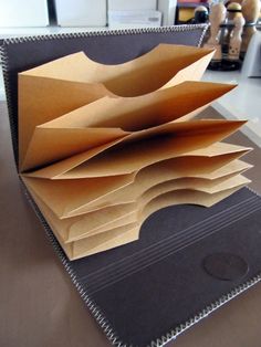 an open folder sitting on top of a table