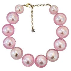 Rare Item - Chanel Ltd Edition 'CC' Logo Pearl Choker Necklace Oversized baby pink faux pearl choker encased in clear resin and detailed with gold 'CC' logo embellishments. Adjustable lobster clasp and a dangle chain with 'CC' logo. From Summer 2017 Collection. Size – One Size Condition – Very Good Composition – Faux Pearls Comes with – Necklace Only Cher Horowitz Jewelry, Chanel Pearl Necklace, Star Necklace Gold, Chanel Necklace, Chanel Pearls, Pink Chanel, Pearl Choker Necklace, Pierced Jewelry, Chanel Vintage