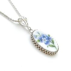 "Broken China Necklace Forget Me Not Flower Necklace Anniversary Gift for Wife Repurposed Jewelry She will love the vintage vibe and sentiment of this blue forget me not necklace. Handmade and repurposed using a vintage tea saucer. Sterling Silver victorian forget me nots china pendant necklace. Our 16\" diamond cut sterling silver rope chain is included. Choose 16\", 18\" or 20\" or 24\" when ordering. Shown on model worn at 24\". If you are not sure of chain length: Our adjustable 22\" chain i Vintage Flower Necklaces For Anniversary, Vintage Flower Jewelry Keepsake, Vintage Flower Pendant Necklace Keepsake, Vintage Flower Pendant Necklace For Keepsake, Vintage Flower Pendant Keepsake Necklace, Vintage Jewelry With Flower Charm For Anniversary, Vintage Flower Pendant Necklace For Anniversary, Vintage Sterling Silver Flower Necklace, Vintage Silver Birth Flower Necklace