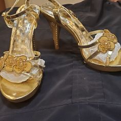 Gold Stiletto Sandals With Rhinestones And Crystals Brand New! Never Been Worn! However Please Note In The Pictures, That Though They Have Been Well Taken Care Of And Protected, There Is A Little Lifting Inside On The Soles, Towards The Back. This Is Probably Due To The Florida Heat And Humidity. If You Have Super Glue Or Shoe Glue Then You're All Set. The Price Will Reflect This Too. Gold Sandals With Rhinestones For Events, Gold Embellished Sandals For Events, Gold Sandals With Rhinestones And Open Heel, Gold Heels With Rhinestones, Open Heel Style, Elegant Rhinestone Open Toe Sandals, Gold Embellished Heels For Events, Gold Closed Toe Sandals With Rhinestones, Gold High Heel Sandals For Prom, Bling Open Toe Heels For Events