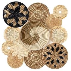 several woven baskets with black and white designs on the bottom one is round, the other has circles