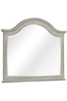 a large white mirror sitting on top of a wall