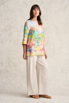 Inject a little joie de vivre into your wardrobe with our Printed Linen Tunic. Featuring pastel tones that come together to create a stunning Abstract Landscape print, this tunic features top stitch detailing along the notched neckline and chic side button detailing. Wear it with our Full Length Waist Tab Linen Pant in Natural Cross Dye for a complete spring-inspired look. Casual Split Neck Tunic For Vacation, Spring Split Neck Top For Daywear, Casual Summer Tunic With Split Neck, Casual Multicolor Split Neck Top, Multicolor Split Neck Casual Top, Casual Multicolor V-neck Tunic, Daywear Relaxed Fit Tunic With Split Neck, Relaxed Fit Split Neck Tunic For Daywear, Multicolor Linen Tops For Spring