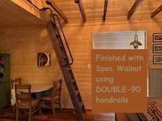 a room that has a ladder in it and a sign on the wall saying finished with spec walnut using double - 90 handrails