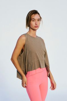 Turn up the tempo in this featherlight tank, with a sweat-wicking finish and a relaxed silhouette that brings a breath of fresh air to your every move. **Fit:** Relaxed fit; arced hem with deep side slits, crew neck **Features:** Airy, sweat-wicking fabrication, four-way stretch fabric that moves with you, relaxed silhouette **Why We ❤ It:** Easy to lounge in, easy to move in, this top keeps you cool and comfortable all day long. | Tempo Tank Top by FP Movement at Free People, Dried Thyme, XS Casual Muscle Tee Tank For Light Exercise, Athleisure Tank Top For Yoga With Relaxed Fit, Relaxed Fit Tank Top For Yoga In Athleisure Style, Versatile Tops For Light Exercise In Spring, Athleisure Relaxed Fit Tank Top For Yoga, Relaxed Fit Athleisure Tank Top For Yoga, Casual Tank Top For Light Exercise, Spring Athleisure Muscle Tee For Sports, Athleisure Tops For Light Exercise In Spring