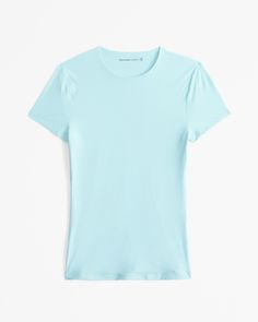 Our new slim-fitting short-sleeve tee in our elevated, barely-there soft matte seamless fabric and tuckable length, with crew neckline and straight hem. Our buttery Soft Matte fabric hugs your body in lightweight compression, with a flattering all-over blur, that's perfect for every body, every day. Female Features, Light Blue Top, Matte Fabric, Halloween Inspo, Blue Top, Business Casual Outfits, Baby Tee, Everyday Style, Women's Tops