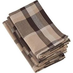 four brown and white checkered towels stacked on top of each other