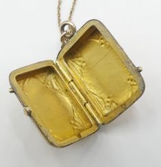 "Vintage gold filled chain and Victorian rectangle photo locket cameo pendant necklace, In good antique vintage condition. The chain 19\" long, Pendant 1\" x 5/8' and ½\" thick. Pendant dates 1890's. Weighs 6.9 gram. Marked 1/20 14k GF on the clasp. Thanks." Vintage Yellow Gold Necklace With Rectangular Pendant, Victorian Engraved Rectangular Necklace, Vintage Engraved Rectangular Pendant Necklace, Victorian Rectangular Locket Jewelry, Victorian Engraved Rectangular Jewelry, Victorian Style Rectangular Locket Jewelry, Antique Gold Necklace With Rectangular Pendant, Victorian Style Engraved Rectangular Jewelry, Vintage Rectangular Locket Pendant