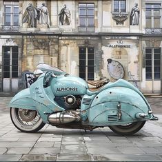 an old blue motorcycle parked in front of a building