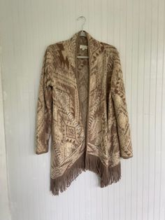 Super cozy & soft western cardigan with retro fringe Size Medium Bust: 42" Length: 36" Cozy Fringe Outerwear For Fall, Cozy Long Sleeve Outerwear With Fringe, Cozy Fringe Cardigan For Fall, Beige Fringe Cardigan For Fall, Fall Beige Fringe Cardigan, Beige Long Sleeve Sweater With Fringe, Fall Fringe Cardigan, Cream Fringe Outerwear For Winter, Winter Cream Outerwear With Fringe