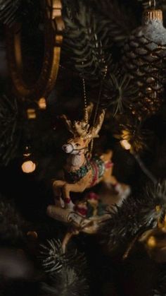 a christmas ornament hanging from the top of a tree