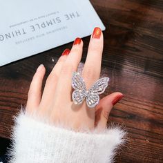 Material: Alloy Color: White Crystal, Pink Crystal Fashion Element: Butterfly Style: Fashion OL White Butterfly Ring For Party, White Alloy Rings For Gifts, Diamond White Crystal Ring Gift, White Crystal Round Ring, White Round Crystal Ring, White Crystal Open Ring For Party, White Crystal Rings For Parties, Index Finger Rings, Rhinestone Material