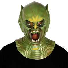 a man wearing an alien mask with his mouth open