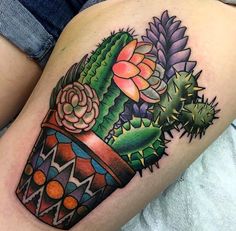 an image of a cactus tattoo on someone's thigh