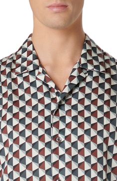 A geometric print adds eye-catching style to this button-up shirt cut from drapey fabric that feels great next to your skin. 30 1/2" length; 44" chest (size Medium) Front button closure Convertible collar Short sleeves 100% lyocell Machine wash, dry flat Imported Patterned Top With Geometric Pattern And Spread Collar, Patterned Geometric Tops With Spread Collar, Summer Button-up Camp Shirt With Button Closure, Cheap Patterned Button-up Camp Shirt, Vacation Graphic Print Button-up Short Sleeve Shirt, Multicolor Graphic Print Button-up Camp Shirt, Multicolor Printed Button-up Camp Shirt, Convertible Collar, Contemporary Accessories