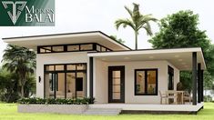 the modern house is designed in white with black trimmings and glass windows, along with palm trees