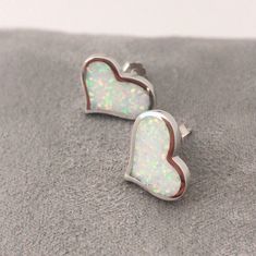 "Love Heart Fire Opal Sterling Silver Stud Earrings, Simple White Opal Studs, Simple Gemstone Earrings, October Birthstone Earrings, hear Opal Earrings' Sterling Silver Fire Opal Stud Earrings. It is made of solid British Sterling Silver and rhodium plating. Rhodium-plated silver is fine sterling silver that is polished and dipped in rhodium. It has a bright finish, similar to white gold items, and it doesn't tarnish. Why do I love to use Opal in my design? I am very passionate about opal becaus White Hypoallergenic Heart-shaped Jewelry, Nickel-free White Sterling Silver Heart Earrings, Nickel-free White Heart Earrings For Anniversary, White Heart Cut Earrings With Heart Charm, White Nickel-free Heart Earrings For Anniversary, White Heart Shaped Earrings For Gift, White Heart Earrings For Gift, White Heart Earrings Gift, White Hypoallergenic Heart Earrings For Anniversary