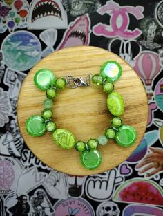 A handcrafted beaded bracelet, with beads in variations of green and a clasp closure. Boys Bracelets, Green Beaded Bracelets, Womens Bracelets, Handmade Bracelets, Jewelry Bracelets, Handmade Items, Beaded Bracelets, Gifts For Her, Women Jewelry