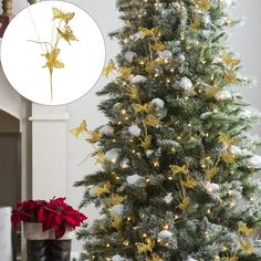 a decorated christmas tree in front of a clock