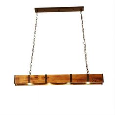 a wooden light fixture with three lights hanging from it's sides and chains on the bottom