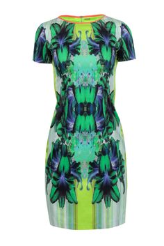 Stand out in the crowd with this funky and fun Elie Tahari dress. Featuring a vibrant green and multi-color print, this short-sleeved dress is perfect for any occasion. Pair it with a neutral pointed-toe pump to complete the look. Get ready to turn heads! Size 4 Shell 97% Cotton, 3% Elastane Neck trim 93% Silk, 7% Elastane Sides 95% Silk, 5% Spandex Lining 100% Polyester Exposed back zipper Short sleeves Blemishes side panels Bust 32" Waist 28" Shoulder to hem 37.5" Sleeve length 7" Green Abstract Print Spring Dress, Green Dresses With Colorful Pattern, Casual Abstract Print Dress With Short Sleeves, Green Graphic Print Dresses, Spring Knee-length Graphic Print Dress, Colorful Printed Vibrant Dresses, Green Summer Dress With Abstract Print, Summer Green Dress With Abstract Print, Green Abstract Print Summer Dress