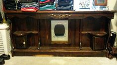 an old wooden cabinet with shoes on it