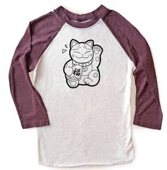 "The waving cat on this super cute tee waves good luck your way! Maneki Neko are popular good fortune cats adored in Japan, and you'll see them outside many shops, attracting good fortune and prosperity. These two-color unisex raglan shirts are made of a lightweight, buttery-soft polyester/cotton blend, and are amazingly comfortable! The 3/4 length sleeves hit just below the elbow, with contrast color sleeves for a stylish colorblock look. ☆ Sizing in inches is as follows ☆ XS - width across che Long Sleeve Cotton T-shirt With Cat Design, White Long Sleeve T-shirt With Cat Design, Kawaii Long Sleeve Tops With Cat Print, Kawaii Long Sleeve Top With Cat Design, Kawaii Long Sleeve Cat Print Top, Casual Long Sleeve T-shirt With Hello Kitty Print, Casual Long Sleeve Hello Kitty T-shirt, Black And Grey Sleeve, Fortune Cat