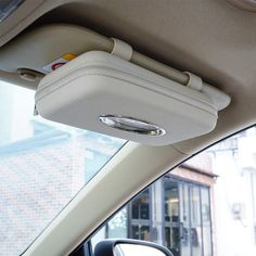 the interior of a car with an electronic device mounted to it's side window