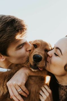 a man and woman kissing their dog on the forehead with an instagramr above them