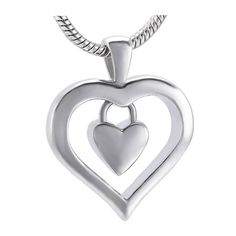 You can carry the remains of that person you love very close to your heart and wherever you are, show your love for that loved one. Do it with this beautiful Heart Charm Cremation Pendant that is made of high quality Stainless Steel that contains a small heart inside a larger heart. In order to fill this cremation pendant with cremains, it is necessary to open a hidden screw that is at the base of the heart. Accepts a small amount of ashes. We recommend putting a dab of glue on the screw to ensu Double Heart Locket Necklace Keepsake, Double Heart Locket Necklace For Keepsake, Heart Shaped Locket Necklace For Memorial, Engraved Double Heart Necklace For Memorial, Memorial Double Heart Engraved Necklace, Keepsake Double Heart Necklace With Heart Charm, Keepsake Double Heart Jewelry With Heart Beads, Keepsake Double Heart Charm Necklace, Double Heart Keepsake Jewelry For Valentine's