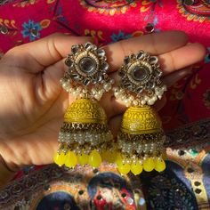 Heavy Jhumka Color: Yellow Condition: Brand New Brand: Nimsim Accessories Message For Inquiries Yellow Jhumka Earrings, Fusion Chandbali Jhumkas With Gota Work, Fusion Style Festive Jhumkas With Gota Work, Festive Fusion Gota Work Jhumkas, Festive Fusion Jhumkas With Gota Work, Fusion Style Jhumkas With Gota Work For Festivals, Yellow Earrings For Party And Festivals, Gold Jhumkas With Mirror Work, Mirror Work Jhumkas For Diwali