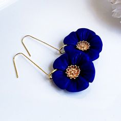 "🌸These handcrafted Navy blue flower clay drop dangle earrings would be a great floral jewelry gift .idea for a wife, girlfriend, best friend, mom or even a trendy teacher gift or bridesmaid gift.   📦FREE DOMESTIC SHIPPING OVER $50. - ✋🏼We use high quality polymer clay and gold plated stainless steel ffindings.  📐Dimensions: 68mm x 30mm  🌟VARIATIONS You can select these in Neon Orange or in Off White IN THE DROP-DOWN SECTION  (MORE colors to come, or message me for a color request)  👉🏼FOR Blue 3d Flower Drop Earrings, Blue Handmade Flower Drop Earrings, Blue Handmade Flower Jewelry For Gifts, Handmade Blue Flower Jewelry For Gifts, Handmade Flower Blue Jewelry As Gift, Blue Handmade Flower Jewelry As Gift, Blue 3d Flower Earrings For Gift, Blue 3d Flower Earrings As Gift, Blue Dangle Flower Earrings In Polymer Clay