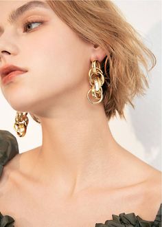 Embrace your daring side with our Goldtone Multi Hoop Drop Statement Earrings! These chic earrings feature multiple hoops that make a bold statement. Elevate any outfit and show off your unique style with these must-have statement earrings. Perfect for the risk-taker in you. 2 3/8" (6cm) drop 7/8" (2.2cm) width Post back Alloy 24k-gold plate Women's drop earrings Item #452902 Chic Metal Wrap Earrings For Party, Chic Party Wrap Earrings In Metal, Chic Metal Wrap Earrings For Pierced Ears, Trendy Pierced Wrap Earrings, Trendy Metal Dangle Wrap Earrings, Metal Dangle Wrap Earrings, Trendy Metal Wrap Earrings, Trendy Pierced Wrap Earrings For Party, Chic Single Metal Hoop Earring