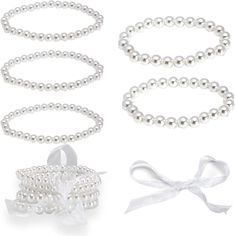 Quantity: 5 Material: Faux Pearl Glass Bead Pearl Size: 5mm x 5mm Bracelet Size: 2.5 inches; adjustable Color: Your choice of ivory or white Each bracelet contains approximately 30 pearls You can add charm , ribbon or take it off part to make your own bracelet or any DIY project . (Sample in last pic ) You can also add charms, ribbons, or remove parts in order to create your own bracelet or any DIY project. Can be worn on any occasion, whether formal evening event or everyday casual. PERFECT FOR Bracelet For Wedding, Make Your Own Bracelet, Faux Pearl Bracelet, Bridesmaid Accessories, Wedding Bridal Party, Glass Bracelet, Pearl Color, Pearl Size, Wedding Bracelet