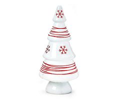 a white ceramic christmas tree with red snowflakes on it's top and bottom