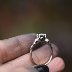 I hand carved a tiny bird skull in jewellers wax, and cast and molded it. I then used the mold to create a duplicate of the skull, and built this ring in wax. The wax model was cast using the lost wax casting method, where the wax is burned away, and the end result is solid 14k gold. The skulls are 4.5x11mm. This ring will be custom made for you, in your ring size. You can choose between yellow, rose or palladium white gold. The pictured ring is 14k yellow gold, with black rhodium that has been White Gold Skull Jewelry For Promise Ring, Silver Brass Promise Jewelry, Silver Brass Jewelry For Promise, Carved 14k Gold Ring, Heirloom Sterling Silver Hand Cast Jewelry, 14k Gold Carved Ring, Heirloom Hand Cast Sterling Silver Jewelry, Antique Sterling Silver Jewelry For Promises, Antique Sterling Silver Promise Jewelry