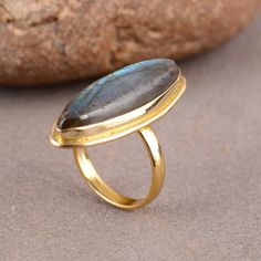 "Simple Labradorite Ring Gold Marquise Shape Blue Flashy Stone Handmade Ring Long Stone Band Ring Engagement Ring Women IMPORTANT NOTE....👇 free surprise gift on purchase of 1 product. 2 rings free gifts on purchase of 5 products. ❥ Customers' satisfaction is our biggest priority, please contact us with any questions/queries for future or existing orders, and we will do our best to make sure you are happy with your order. ❥Please make sure to add the correct address during checkout. You can ret Bohemian Jewelry With Bezel Setting For Gift, Gold Turquoise Ring With Large Stone As Gift, Turquoise Moonstone Ring With Natural Stones As Gift, Blue Labradorite Ring, Turquoise Toe Ring As Gift, Labradorite Rings With Natural Stones For Gift, Blue Labradorite Rings As Gift, Blue Labradorite Rings For Gift, Blue Labradorite Rings For Gifts