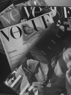 the covers of various magazines are stacked on top of each other in black and white