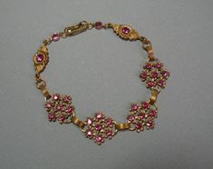 7 inch (nos) vintage brass flowers feature rose colored crystal rhinestone accents with a foldover clasp. Vintage Flower Shaped Jewelry With Rhinestones, Vintage Flower-shaped Jewelry With Rhinestones, Rose Flower Bracelet, Brass Flowers, Flower Bracelet, Rose Color, Pretty Jewellery, Color Crystal, Dream Clothes