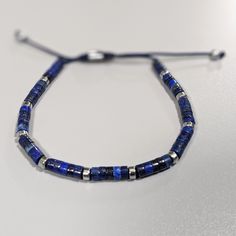 Add a pop of bold color to any outfit with our Sapphire Adjustable Macrame Knot Bracelet! Made with vibrant, dyed sapphires, this bracelet is not only eye-catching but also adjustable for the perfect fit. High-quality Dyed Sapphire Bracelet Simple contemporary design Weight: 8-8.4 grams Bead size: 4 mm Blue braided cord Adjustable macrame knot One size fits all Bracelet Simple, Macrame Knot, Cuff Bangle Bracelet, Knot Bracelet, Sapphire Bracelet, Bold Color, Cuff Bangles, Ring Collections, Granada