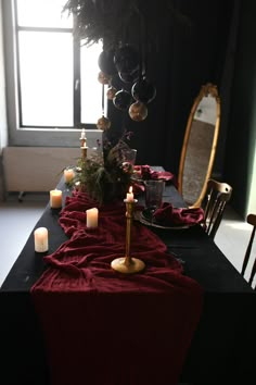 the table is set with candles and decorations