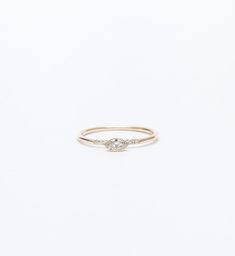 An east-west setting makes this diamond ring feel extra sleek and flattering on the hand. Adapting her signature Equilibrium design to the elongated form of a marquise, Jennie Kwon makes a compelling argument for wearing diamonds every day. Wear it alongside slender, textured bands to give the center diamond room to shine. Made in the U.S.A. All sizes available by special order in 3-4 weeks. To inquire, including requests for alternate metal and gemstone options, please contact us. 14 karat gold Jennie Kwon, Marquise Diamond Ring, Mom Ring, Marquise Ring, Nature Ring, Royal Jewels, Marquise Diamond, Pretty Rings, Minimalist Rings