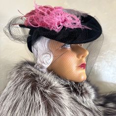 What A Stunner!!! This Hat From The 1930s' Is Made Of A Very Fine Velour Felt. The Flat Top Is Adorned By 3 Different Colored Ostrich Feathers: Fuchsia, Pink And Grey. There Is A Cap At The Back Under The Flat Top, Which Holds This Tilt Hat In Place. This Cap Has Two Openings At Each Side, As Shown In The Photos, To Add More Drama To This Visually Stunning Hat. To Finish The Look, There Is A Large Black Veil, Which Ends In Two Streamers At The Back. Tilt Hats Were Popular In The 1930s And 1940s. They Were Worn At An Angle And Held To The Back Of The Head By A Strap, Rigid Ring, Elastic Band Beneath The Hair, Or A Combination Of These. Store Label: Carson, Pirie Scott & Co. - Chicago There Vintage Pink Fitted Fascinator, Vintage Black Costume Hats For Spring, Pink Fitted Mini Hat For Winter, Fitted Pink Mini Hat For Winter, Vintage Pink Hat For Evening, Vintage Fitted Pink Hat, Fitted Vintage Pink Hat, Vintage Pink Evening Hat, Black Mini Hat For Vintage Events And Kentucky Derby